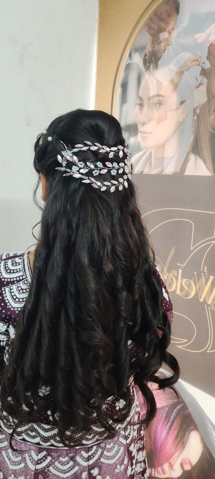Long glossy waves with a jeweled hair accessory